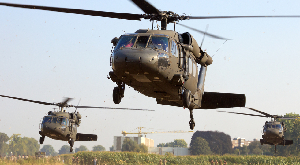GRAVE, NETHERLANDS - SEP 17: American Black Hawk helicopters take off at the Operation Market Garden memorial on Sep 17, 2014 Grave, Netherlands. Market Garden was a large Allied operation in 1944.